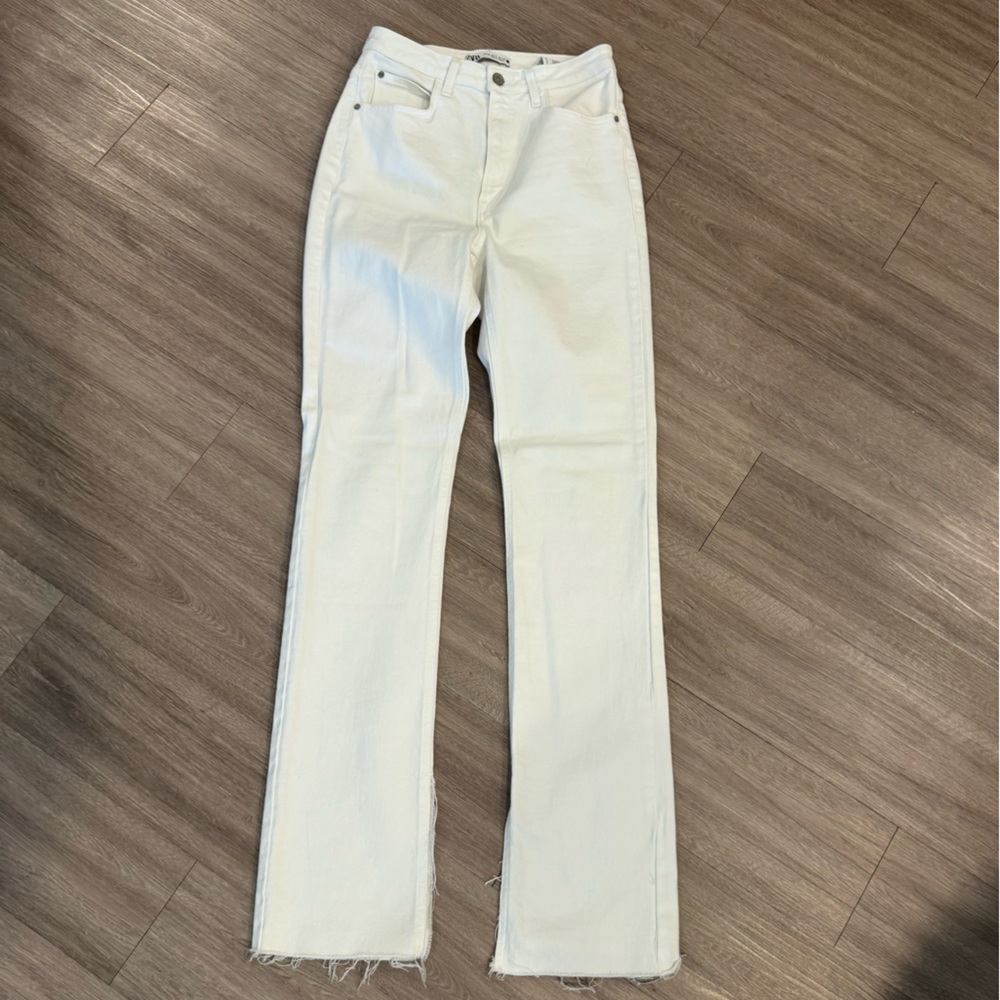 White Zara jeans with split hem
